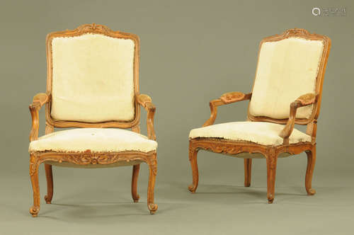 A pair of French walnut open armchairs,