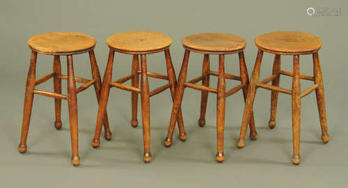 Four 19th century bar stools, each with angled turned legs a...