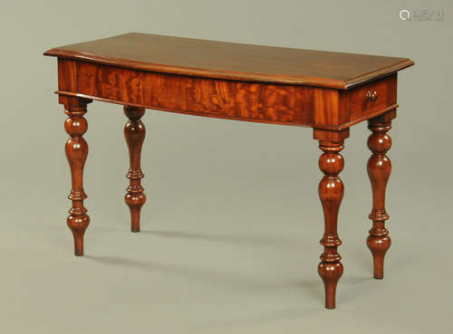 A Victorian mahogany serpentine fronted side table,