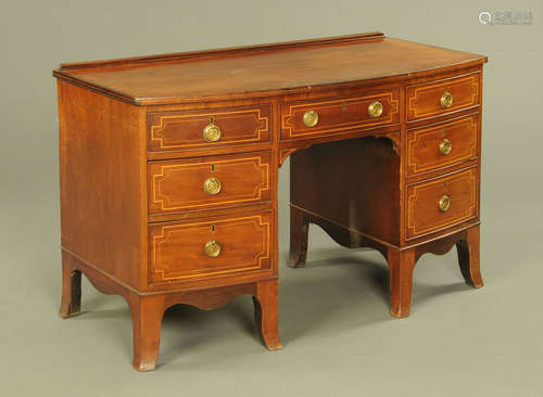 A 19th century mahogany bowfronted kneehole desk,