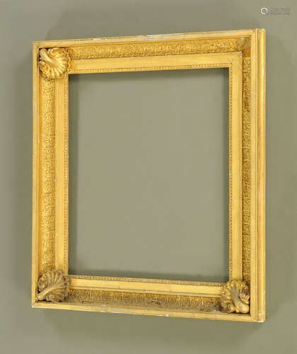 A 19th century gilt moulded picture frame, with prominent sc...