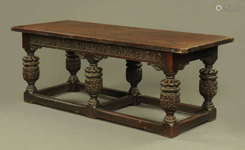 A large Elizabethan style oak refectory or serving table,