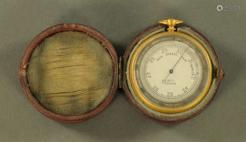 A pocket barometer by MTC London, cased. Diameter 50 mm.