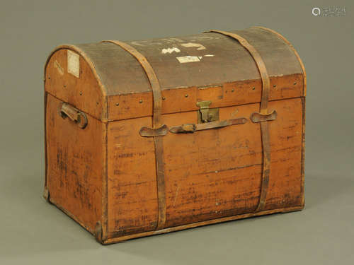 A large 19th century brown canvas covered domed top trunk, t...