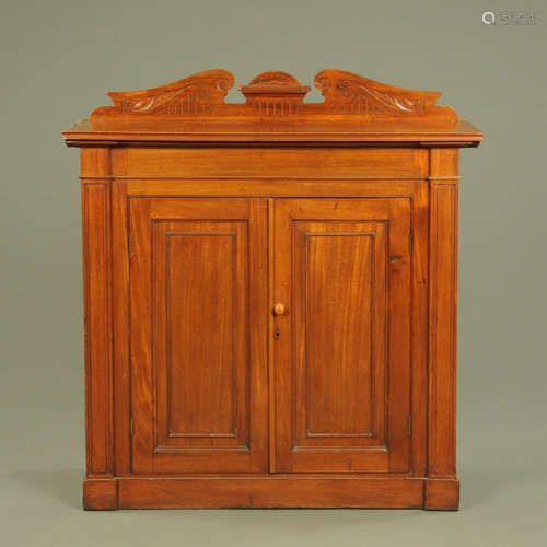 An Edwardian walnut cabinet, with rear upstand and two doors...