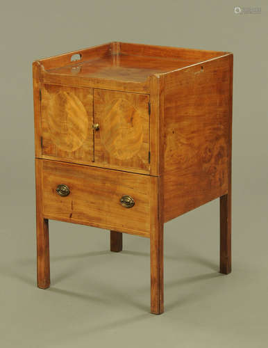 An early 19th century mahogany bedside cabinet,