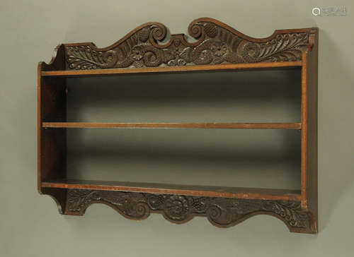 A Victorian oak bookcase, with carved swans neck pediment ab...