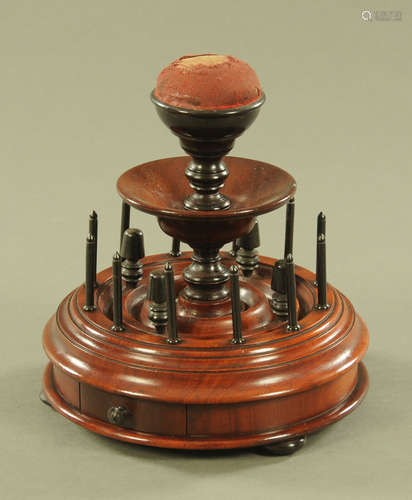 A Victorian mahogany bobbin and thimble stand. Diameter 21 c...