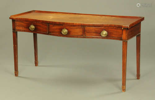 A Georgian mahogany serpentine fronted serving table,