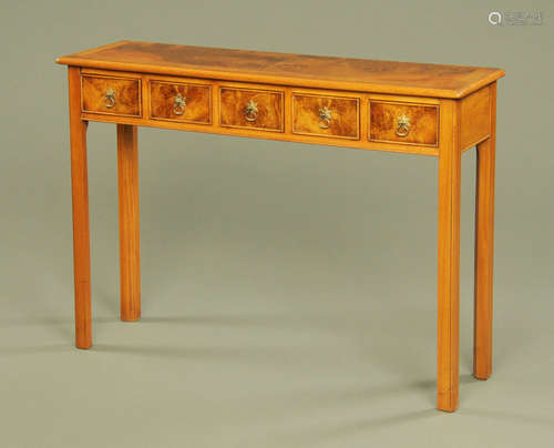 A walnut five drawer hall table,