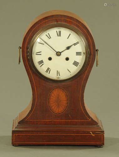 A large Edwardian inlaid mahogany balloon clock, with two tr...