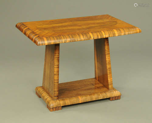 An Art Deco veneered side table, with angled supports and lo...