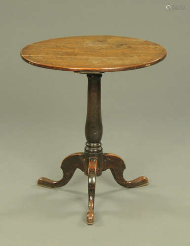 A George III oak circular topped tripod occasional table rai...