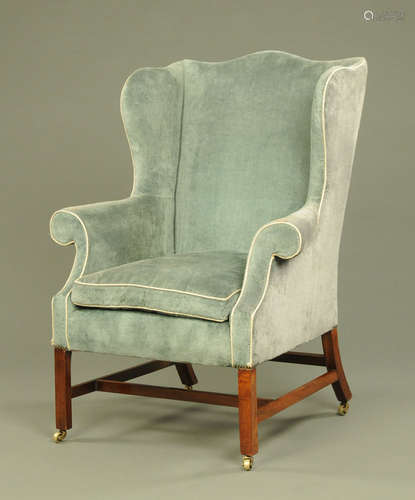 A George III style mahogany framed wing easy chair,