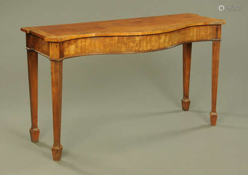 A George III mahogany serpentine fronted serving table,