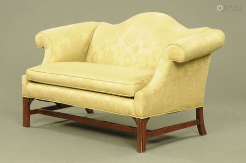 A Chippendale style settee, with arched back,