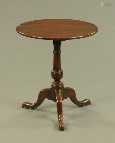 A George III style yew wood tripod table,