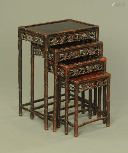 A quartetto of Chinese tables, each with pierced frieze and ...