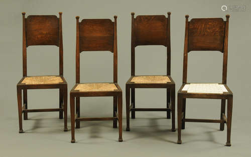 A set of four Arts and Crafts oak dining chairs by William B...