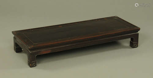 A 19th century Chinese hardwood low table, with moulded edge...