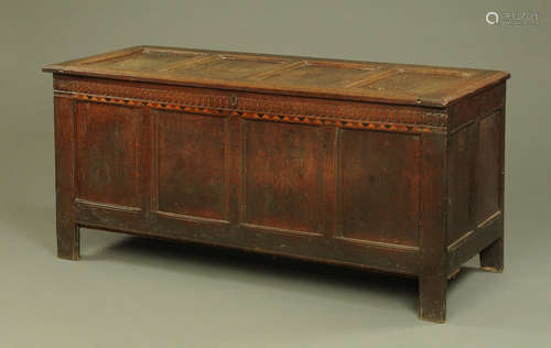 A large late 17th century oak coffer, with four panelled fro...