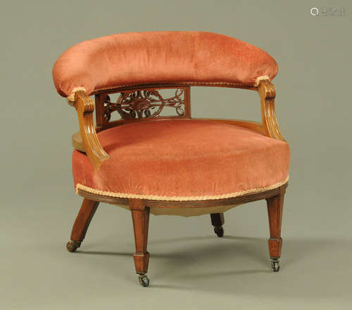 A late Victorian/ Edwardian walnut ladies tub chair,