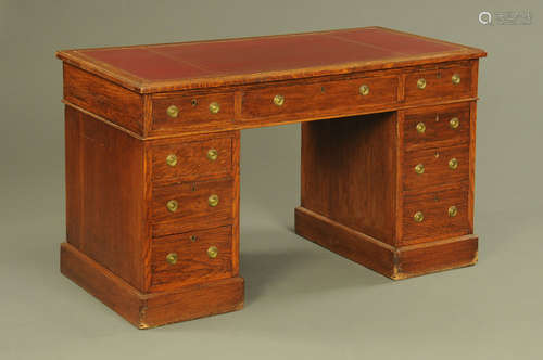 A late Victorian/Edwardian oak pedestal desk,