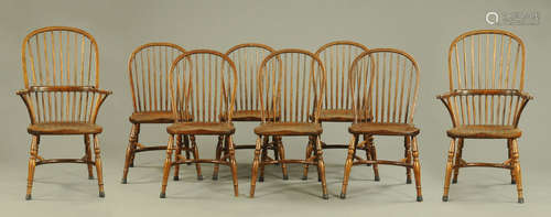 A set of two carver arm and six single Windsor style dining ...