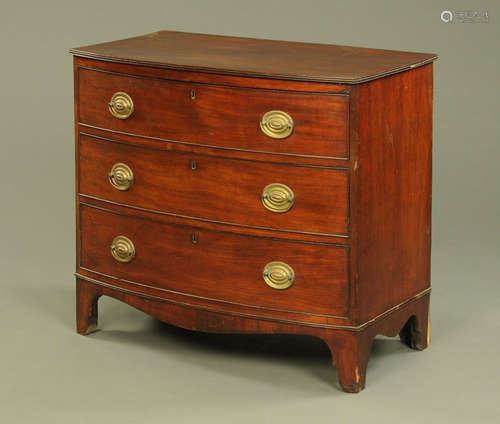 An early 19th century mahogany bowfronted chest of drawers,