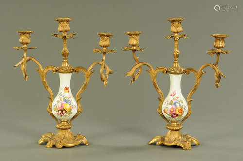 A pair of Continental porcelain and gilt metal mounted three...