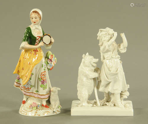 A Continental porcelain figure of a shepherdess with tambour...