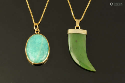 Two 9 ct gold pendants, one in the form of a green jade 