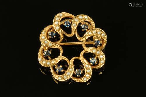 A 9 ct gold seed pearl and sapphire set circular brooch, dia...