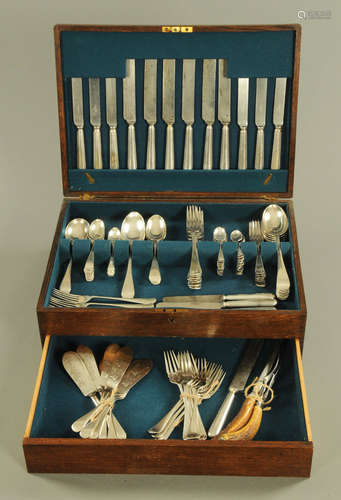 An oak canteen containing a quantity of silver plated cutler...