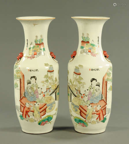 A large pair of Chinese polychrome vases, with numerous char...