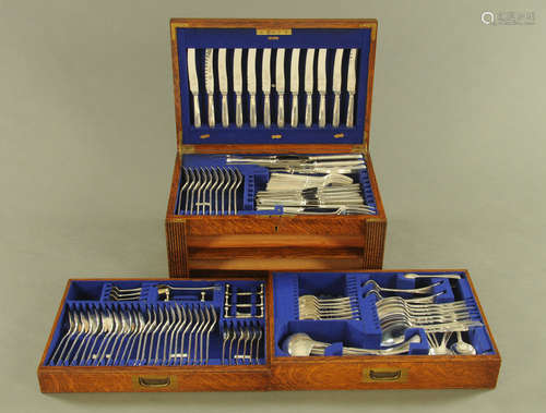 An oak canteen containing a quantity of silver plated cutler...