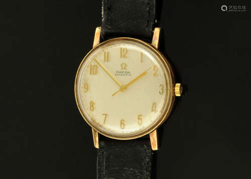 A gentleman's 9 ct gold Omega wristwatch, with leather strap...