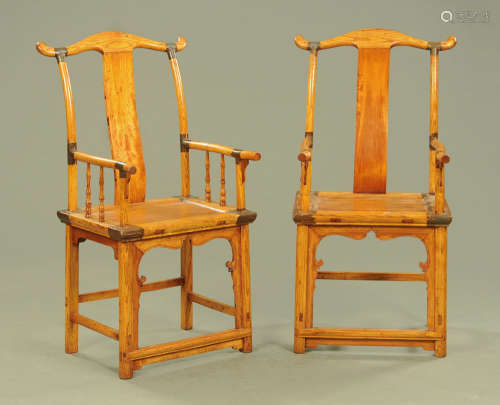 A pair of Chinese elm armchairs. Width across arms 54 cm, he...