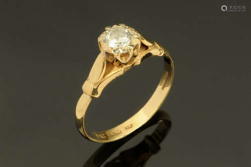 A 9 ct gold ring with single clear stone, Size M.