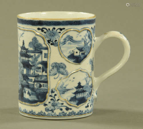 An antique Chinese blue and white tankard,