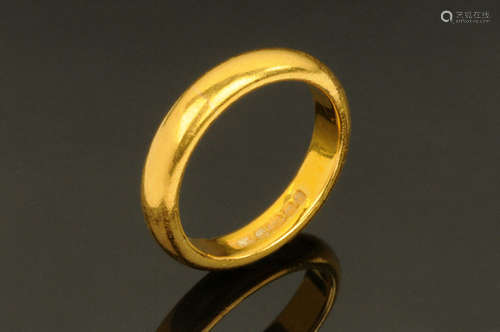 A 22 ct gold wedding band, Size L. 6.3 grams.