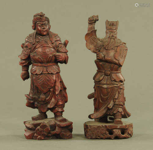 Two Chinese stained and carved wood figures of warriors, eac...