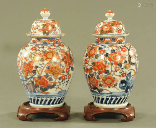 A pair of 19th century Imari porcelain lidded vases,