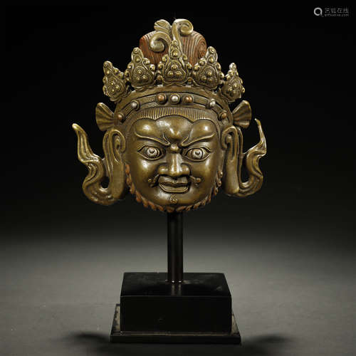 A TIBETAN SILVER-INLAID BRONZE BUDDHA HEAD