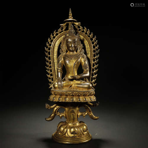 A CHINESE GILT-BRONZE BUDDHA STATUE