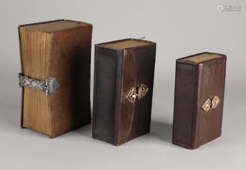 3 Bibles with gold and silver