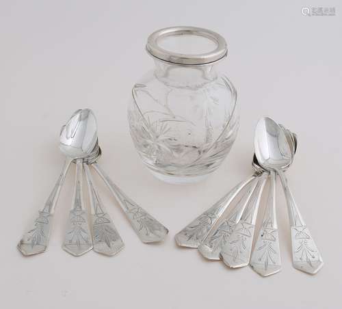 Spoon vase with silver spoons