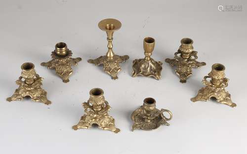 Eight brass candlesticks