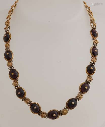 Gold necklace with garnet