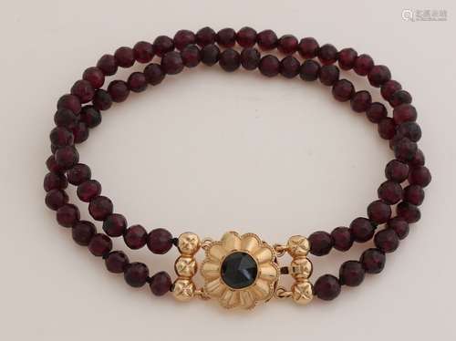 Garnet bracelet with gold.